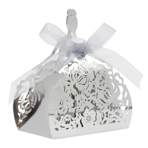 Detailed silver laser-cut floral candy box with a white ribbon bow for weddings