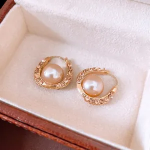 French style gold U-shaped earrings with champagne pearl and pavé rhinestones