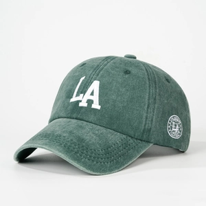 Vintage dark green washed cotton baseball cap with white LA embroidery in a retro style