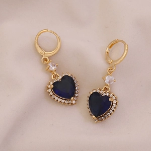 Elegant gold heart earrings with deep blue gemstones and sparkling crystal halo