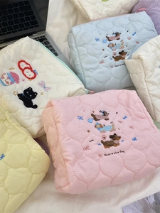 Pastel quilted makeup bags with cute animal embroidery and Have a Nice Day slogan