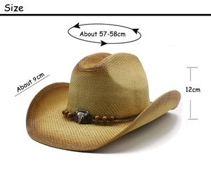 Detail of straw cowboy hat featuring a leather band with bull skull and wooden beads