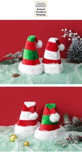 Detail of plush Christmas hat with red and green stripes and fluffy white pom-pom décor