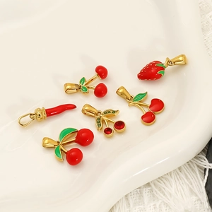 Elegant fruit pendants featuring cherry and strawberry designs with gold metal base