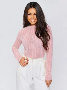 Detailed view of the pink long-sleeved top featuring a unique pleated texture and round neck