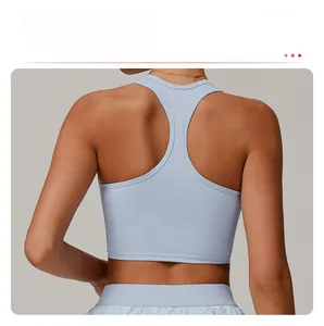 Close-up of light blue racerback sports bra showing seamless mesh and elastic fabric