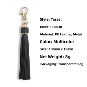 Detailed view of 150mm black PU leather tassel keychain with golden metal lobster clasp