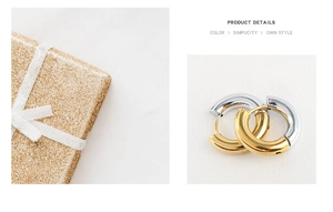 Detail of 4mm gold and silver two-tone hoop earrings with a metallic glossy finish