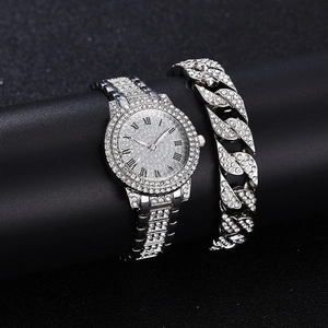 Detail of silver ladies watch and Cuban bracelet set with shimmering pavé rhinestones