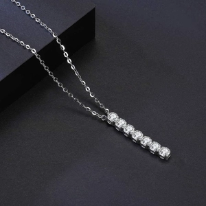 Elegant silver horizontal bar pendant necklace with seven sparkling round cubic zirconia