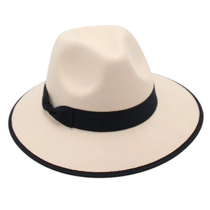 Detail of beige wool felt fedora hat featuring black ribbon and contrast bound edge