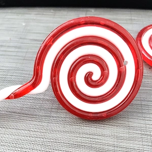 Detailed view of red and white spiral lollipop Christmas tree hanging ornament