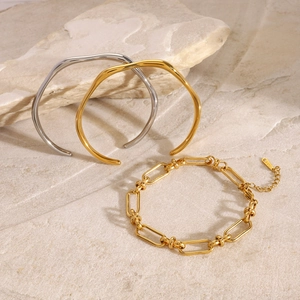 Minimalist wavy open bangles and paperclip chain bracelet in gold and silver finish