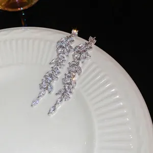 Leaf-shaped zircon earrings with long tassels and marquise stones in silver finish