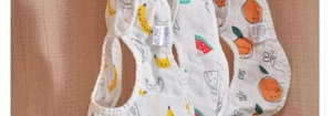 Detail of multi-layer cotton baby bibs with banana, watermelon and orange prints