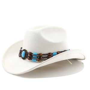 Detail of white suede cowboy hat with ethnic beaded band and turquoise stone accessory