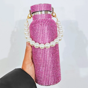 Detail of pink rhinestone coffee tumbler with double-layer stainless steel and pearl strap