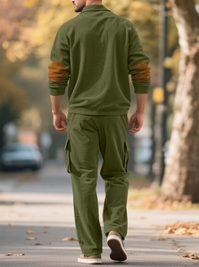 Men's green corduroy leisure set featuring a back view of the zip collar top and trousers