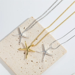 Minimalist ocean style starfish pendant necklaces in polished gold and silver finishes
