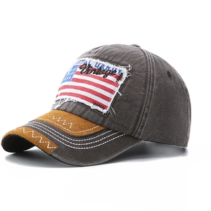 Vintage dark grey baseball cap with American flag patch and distressed denim finish