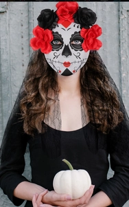 Close-up of Day of the Dead mask with red roses and black lace veil for Halloween