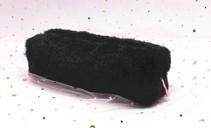 Macro view of plush black faux fur pencil case with a metallic zipper detail