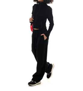Detail of vintage black fleece tracksuit showing the high neck zip jacket and wide-leg pants