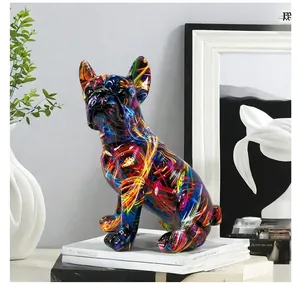 Macro shot of French Bulldog resin sculpture with colorful graffiti art on a bookshelf