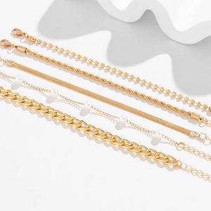 Detail of 5pcs gold bracelet set with pearl accents and adjustable lobster clasps