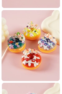 Macro shot of assorted resin donut charms with colorful toppings and realistic details