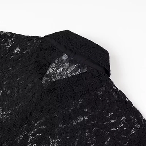 Close-up of the delicate lace texture and polo collar of this black short lace blouse