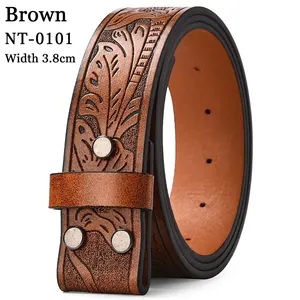 Macro detail of brown leather western belt with leaf embossing and silver studs, 3.8cm wide