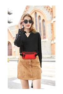 Street style view of a red running waist bag with multiple zipper compartments for outdoor sports