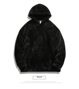 Flat lay of black polar fleece hoodie with spacious kangaroo pocket and soft texture