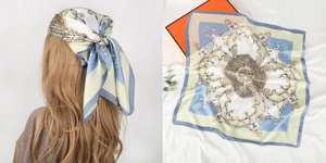 Detailed view of baroque print square scarf with gold and blue floral palace patterns