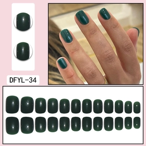 Short round dark green press-on nails set with high-gloss finish, 24 pieces display