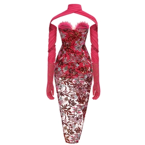 Detailed view of red sequin embroidery and pink lace sleeves on a strapless dress