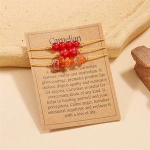 Detailed view of Carnelian beaded bracelets with irregular stones on a display card