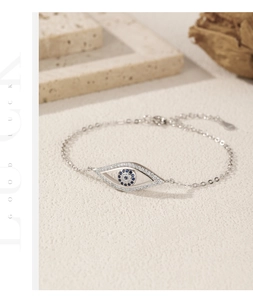 Detailed close-up of S925 silver evil eye bracelet with blue and white zircon stones