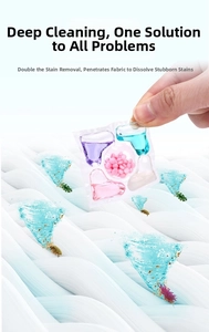 Macro detail of multi-chamber laundry pods with concentrated liquid and scent booster beads