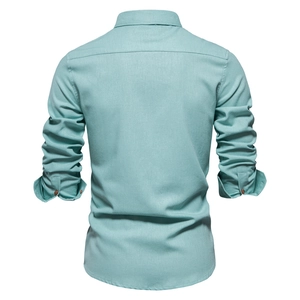 Detailed back view of a men's long-sleeve cotton shirt in mint green with neat seams