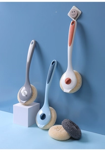 Detail of long-handle kitchen cleaning brushes with colorful replaceable fiber scrub heads