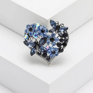 Vintage heart brooch with blue rhinestone butterflies and crystals on silver metal