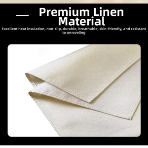 Linen placemat detail showing heat-resistant fabric texture and durable overlocked edges