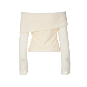 Close-up of creamy off-white knit top showing rich textured fabric and elegant off-shoulder cut