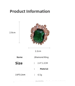 Close-up of vintage emerald green gemstone ring with rhinestone halo and 2.8x2.2cm size