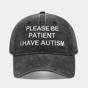 Vintage washed black cotton baseball cap with white embroidered autism awareness text