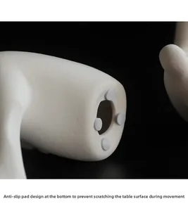 Detail view of anti-slip pads on modern white matte ceramic sculpture base for protection
