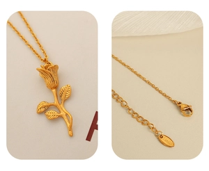 Macro detail of golden stainless steel rose pendant and secure lobster clasp closure