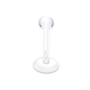 Macro shot of a clear acrylic labret piercing stud with a round ball top and flat base